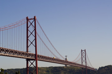 Fototapeta na wymiar Bridge over river and King Christ in the background