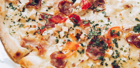 Traditional Italian pizza with cheese,ham,salami,mushrooms and tomato, Traditional beked cuisine bread,pie,sliced, tasty dinner