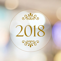 Obraz premium 2018 on blur abstract bokeh background, new year greeting card, banner