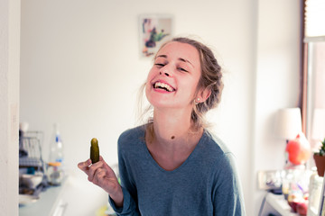pregnant woman fooling around with pickles