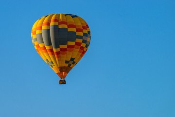 Colorful hot air balloons against blue sky