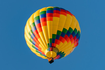 Colorful hot air balloons against blue sky