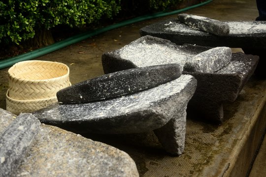 Metate, metlatl or mealing stone for corn in Mexico