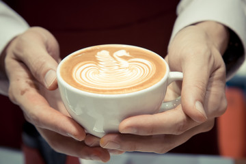 Barista Holding The Cup Of Coffee Service Concept