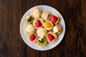 Mini Tarts, Tartolet or Tartlets with cream and fresh fruits