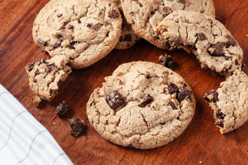 Homemade Chocolate chip cookies on wood plate.