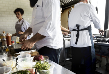 Group of chefs working in the kitchen