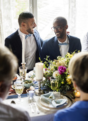 Cheerful Gay Couple in Wedding Reception