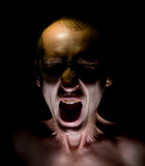 Stylish dark portrait of screaming adult caucasian man.