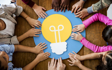 A group of primary schoolers learning about electricity conservation