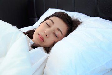 woman in white shirt sleeping on her bedroom. concept for healthy.
