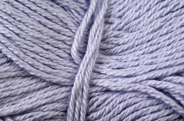 A super close up image of lavender yarn