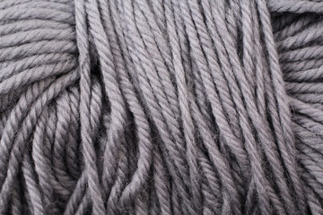 A super close up image of gray yarn