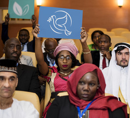 A Group of International Delegates Are Showing Symbol of Peace and Environment