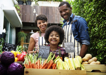 Farmers selling fresh organic vegetables at the market