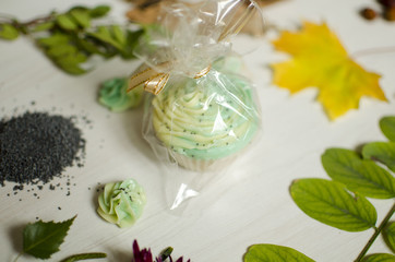 Natural organic cosmetics. Hand Made soap on the white wooden background.