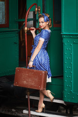Fashion retro stylish girl in railway station