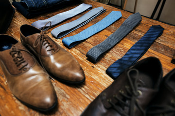 close up of shoes and neck ties