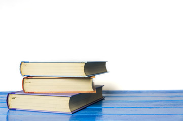Closeup hardcover book isolated on white background. Selective focus.