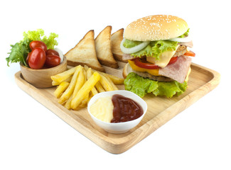 Pork hamburger Homemade with grilled bacon contains vegetables, cheese, lettuce, onion, chilli, spices in a wooden dish isolated on white backgroud