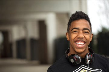 Happy young teenager listening to music.
