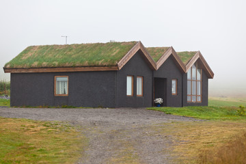 Rural Icelandic cottage at foggy day