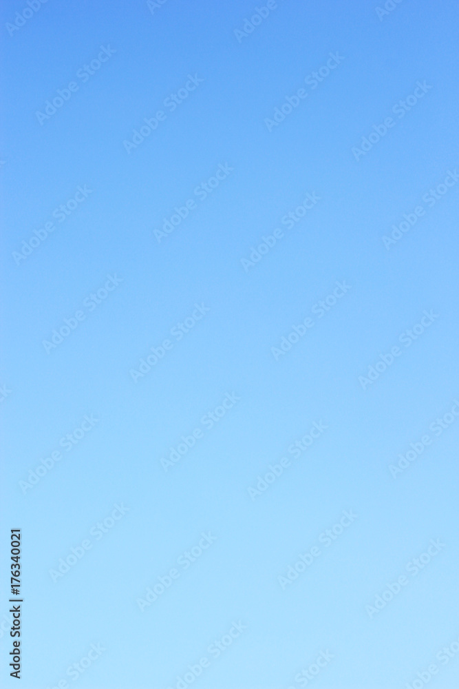 Wall mural clear blue sky background and empty space for your design, no cloud