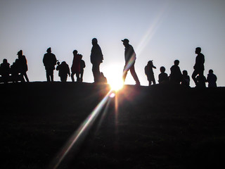Silhouette on sunrise , a group of tourists with the light of the sun ,travel to nature.