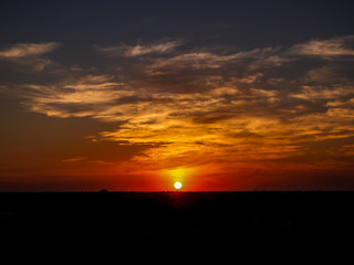 beautiful orange  clouds and the sun at Sunset time.