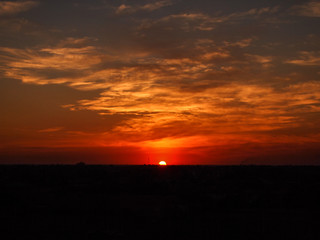 beautiful orange  clouds and the sun at Sunset time.