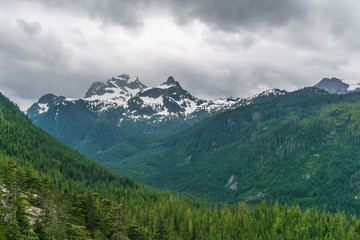 High mountain landscape with heavy rainy clouds.