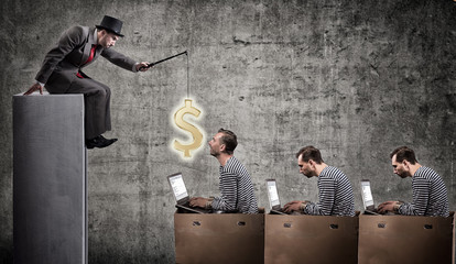 A greedy businessman motivates office workers with a salary. Office slavery concept. - obrazy, fototapety, plakaty