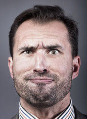 Obraz premium Man portrait with a strange expression