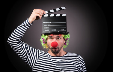 Funny clown with clipper box.
