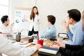 Asian businesswoman leader meeting with colleagues in the office.