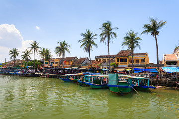 Fototapeta na wymiar Bach Dang wharf at Hoi An Ancient Town, Quang Nam, Vietnam. Tourist can get on a boat to explore a whole lot more of Hoi An, Thu Bon river and the delta.