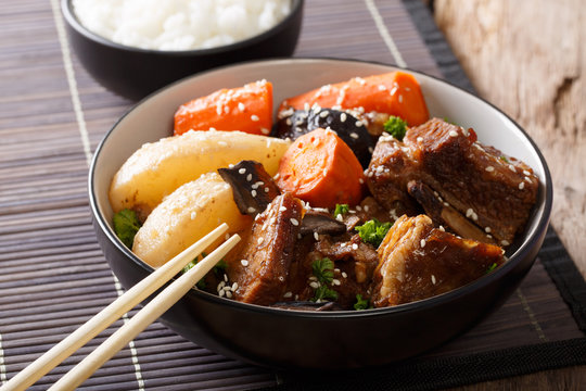 Galbi jjim Korean Braised Beef Short Ribs with rice close-up. Horizontal