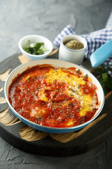 Eggs with spices, herbs and tomato sauce