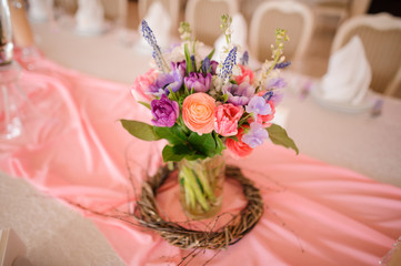 Table decoration made of a vase with beautiful flowers