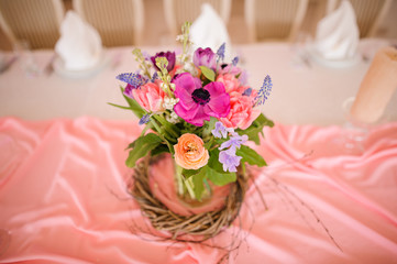 Stylish table decoration made of vase with beautiful flowers