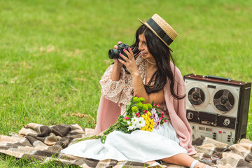 stylish girl with camera in park