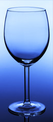 wine glass on dark blue background close up