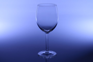 wine glass on dark blue background close up