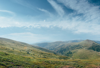 The mountain view with the nice sky in the warm sun light