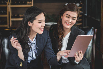 Asia business women discussing and meeting together in the office.