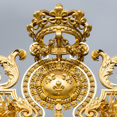 The golden gate of the Palace of Versailles, or Chateau de Versailles, or simply Versailles, in France
