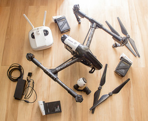 Professional camera drone with remote control, battery, propeller, charger and camera.