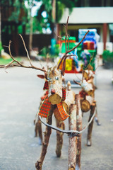 Decorative Santa reindeer  made of wood logs and branches. Christmas concept