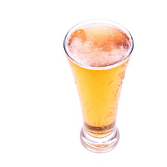 Fresh gold cold and delicious lager beer in glass over white background