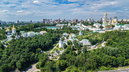 Fototapeta na wymiar Aerial top view of Kiev Pechersk Lavra churches on hills from above, cityscape of Kyiv city, Ukraine 
